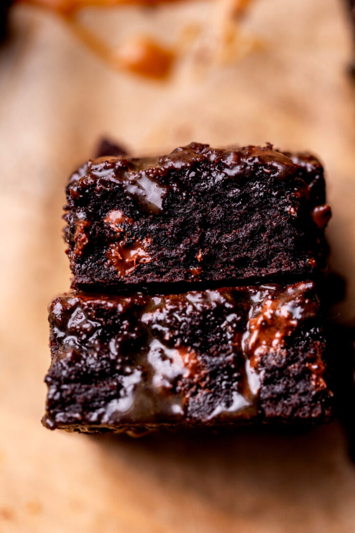 Stack of two caramel brownies on its side.