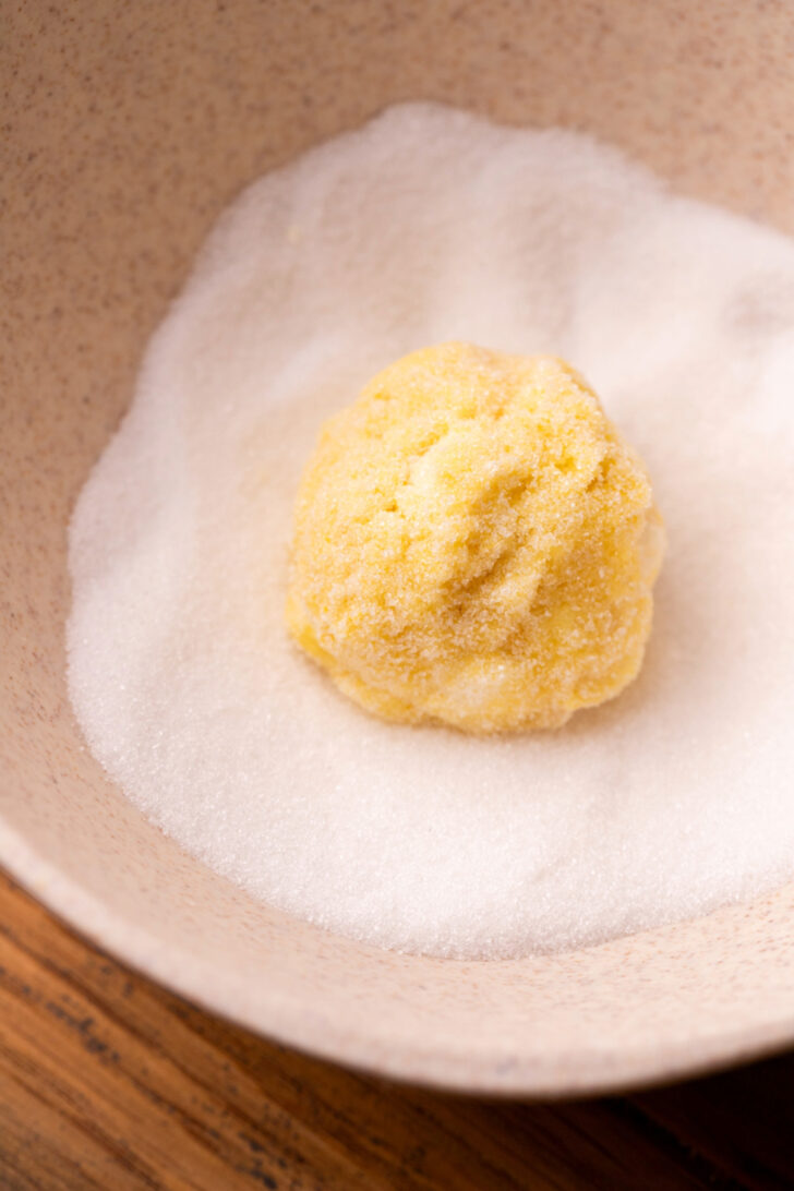 Cookie dough ball in sugar.