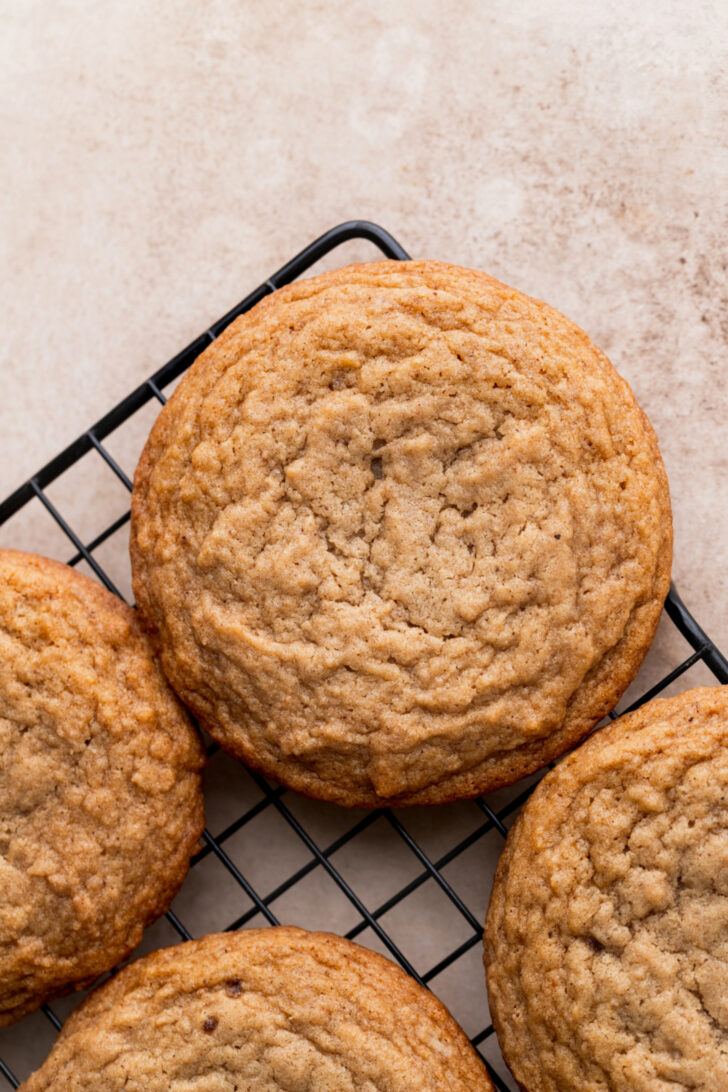 Baked cookies on a wire rack.