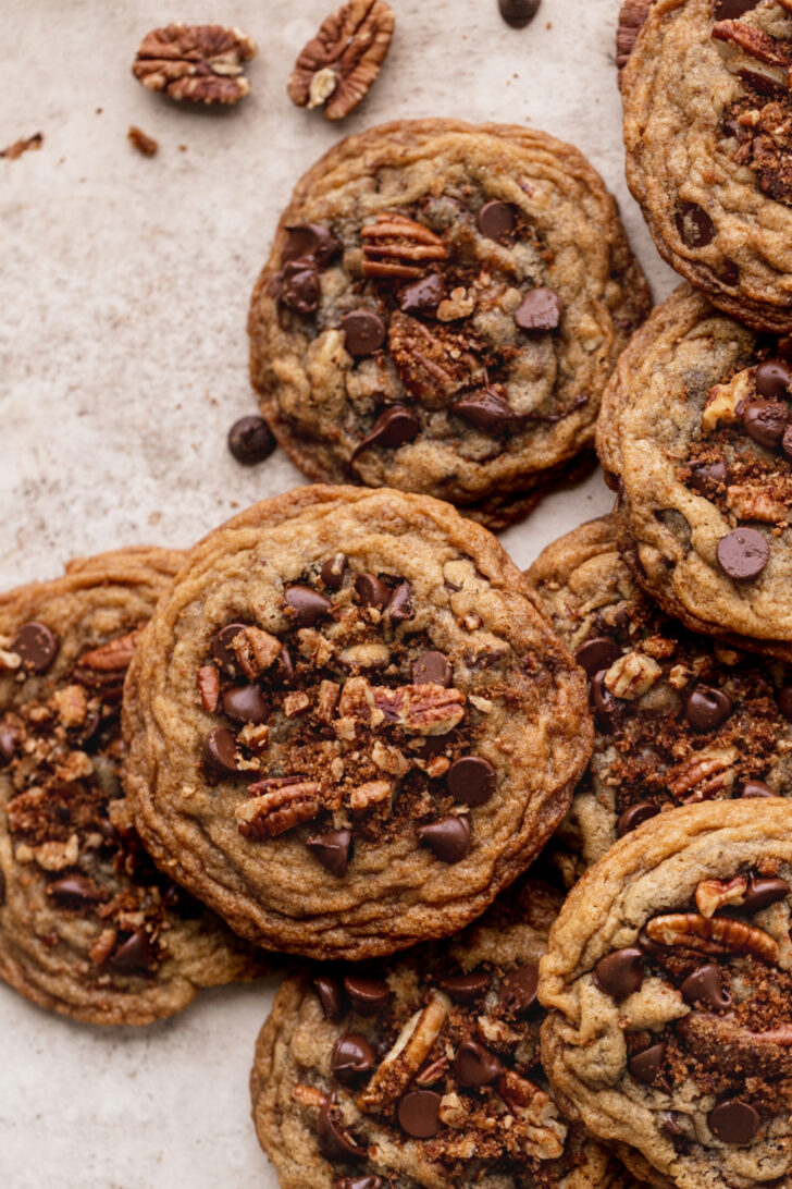 Top view of multiple pecan chocolate chip cookies.