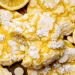 Top view of a lemon crinkle cookies missing a bite.