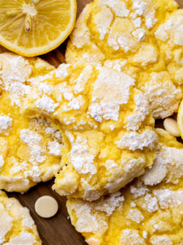 Top view of a lemon crinkle cookies missing a bite.
