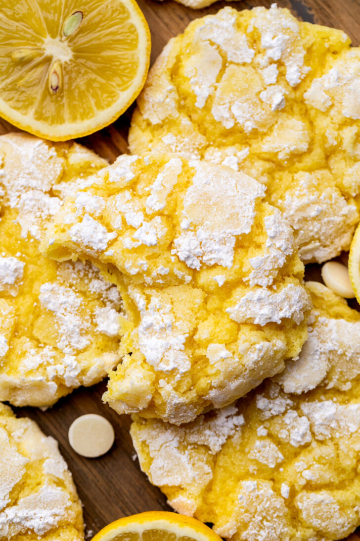 Top view of a lemon crinkle cookies missing a bite.