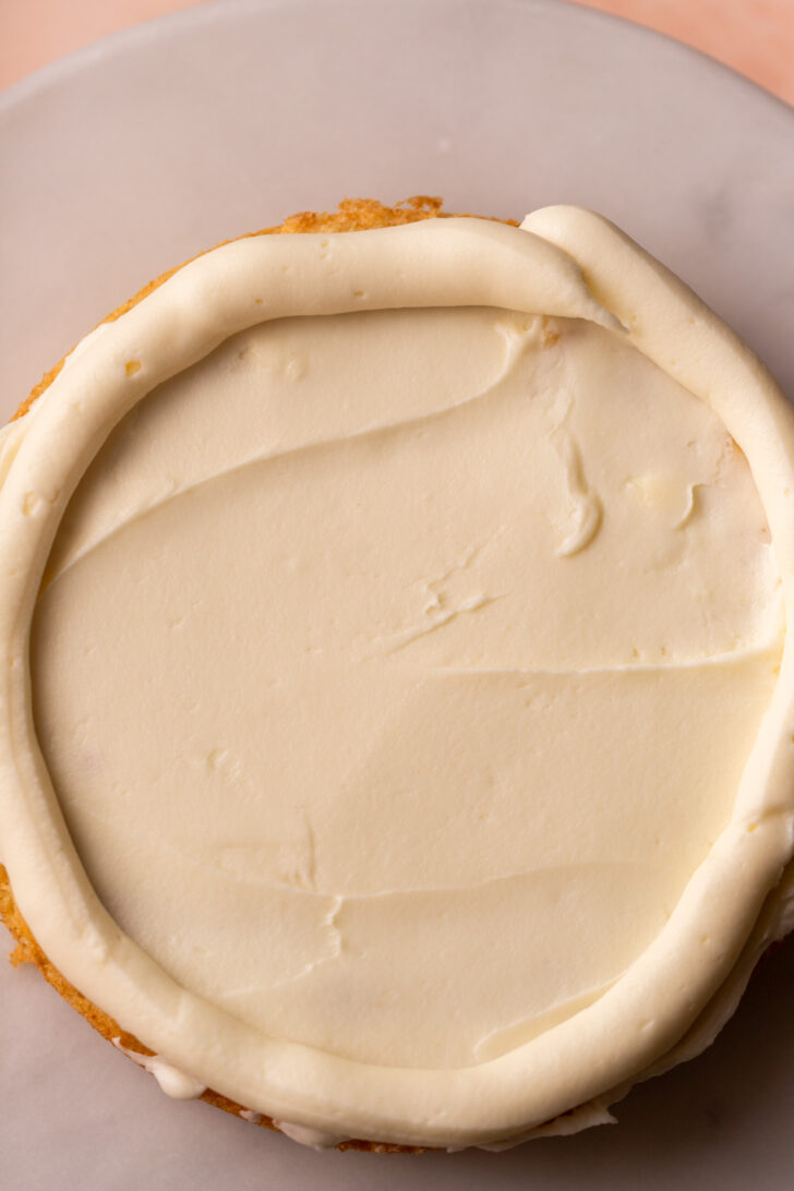 Frosting on top of cake.