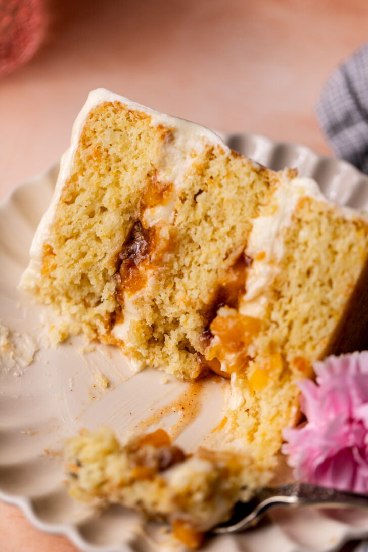 Bite missing from peach cobbler cake.