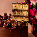 Taking a slice out of the yellow cake.