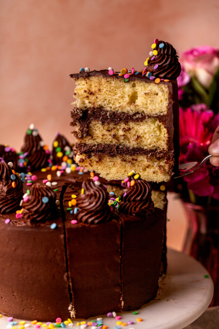 Taking a slice out of the yellow cake.