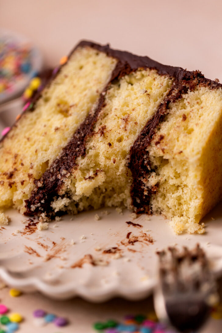 Bite missing from a slice of cake.