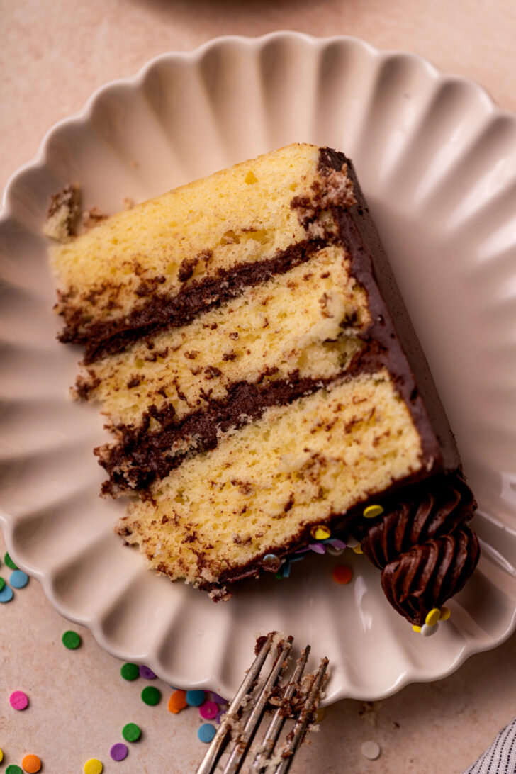Slice of yellow cake on a plate.