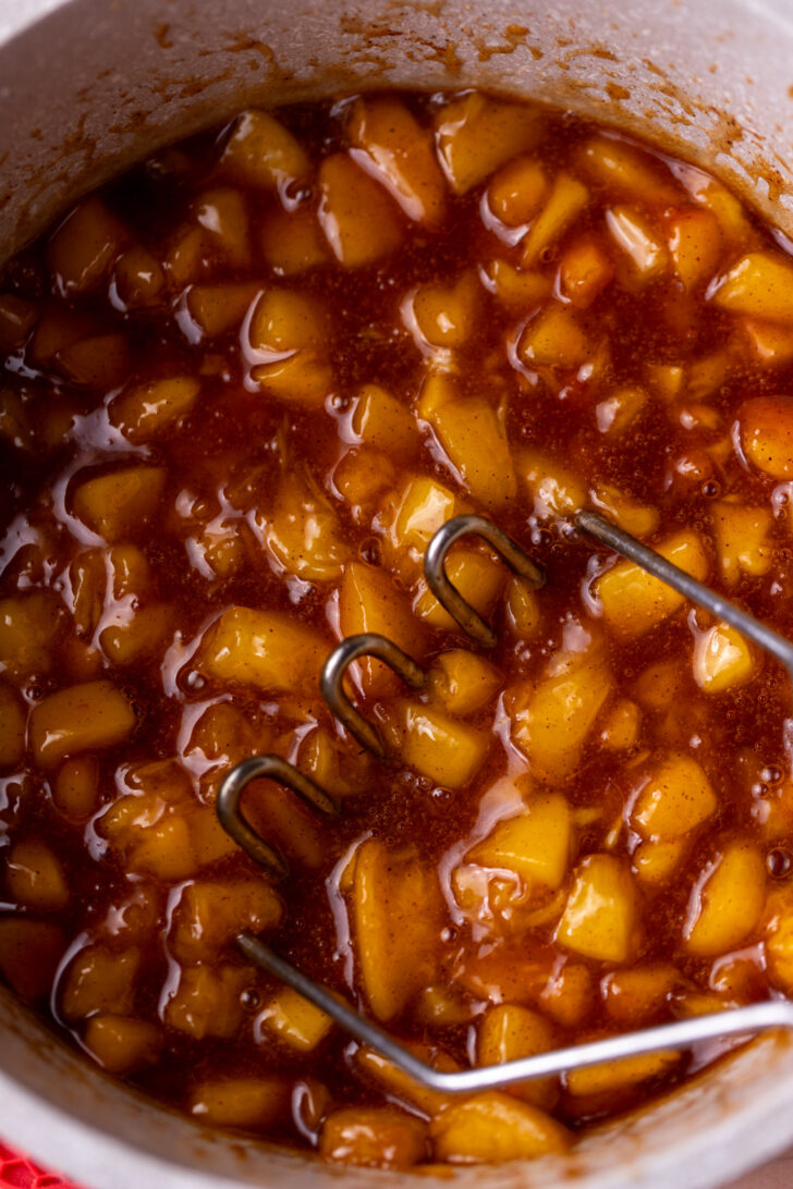 Peach filling with a masher.