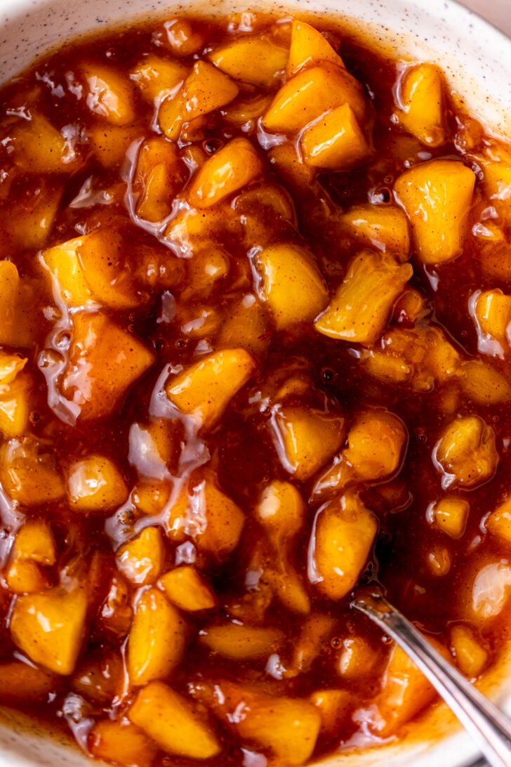Close up of peach pie filling.