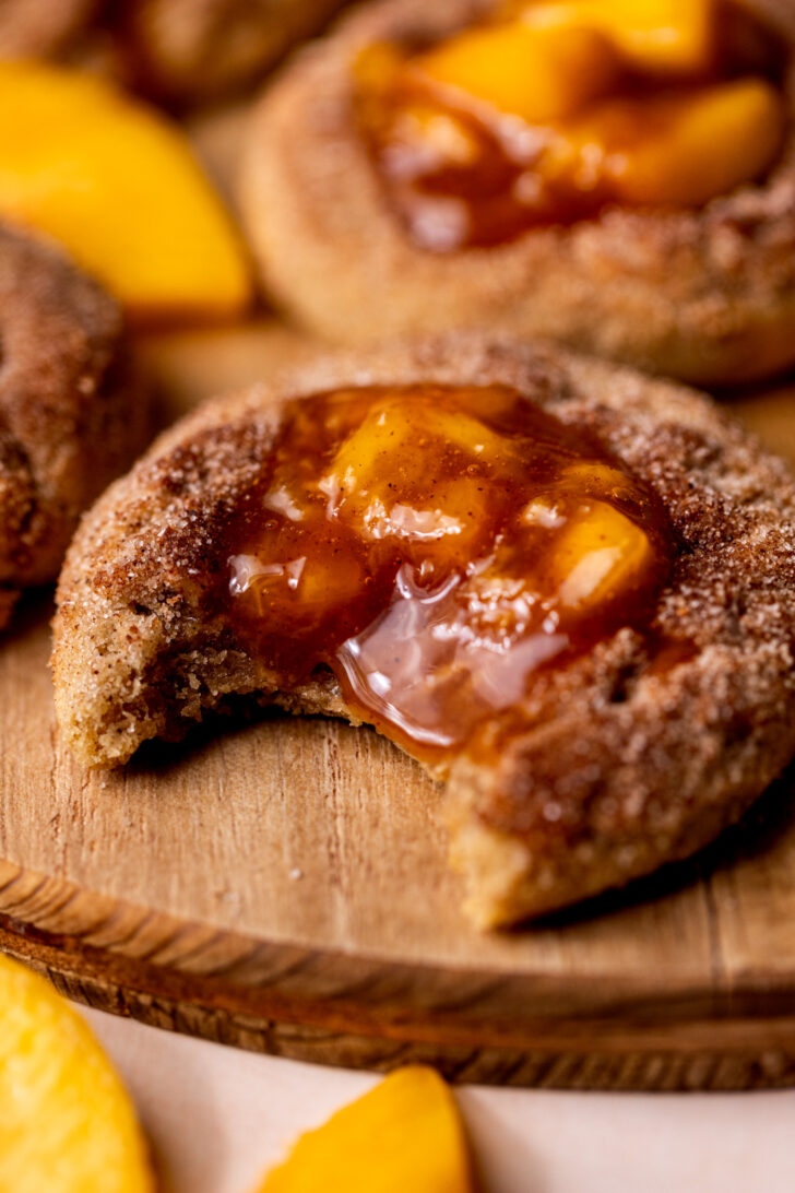 Bite missing from peach cobbler cookies.