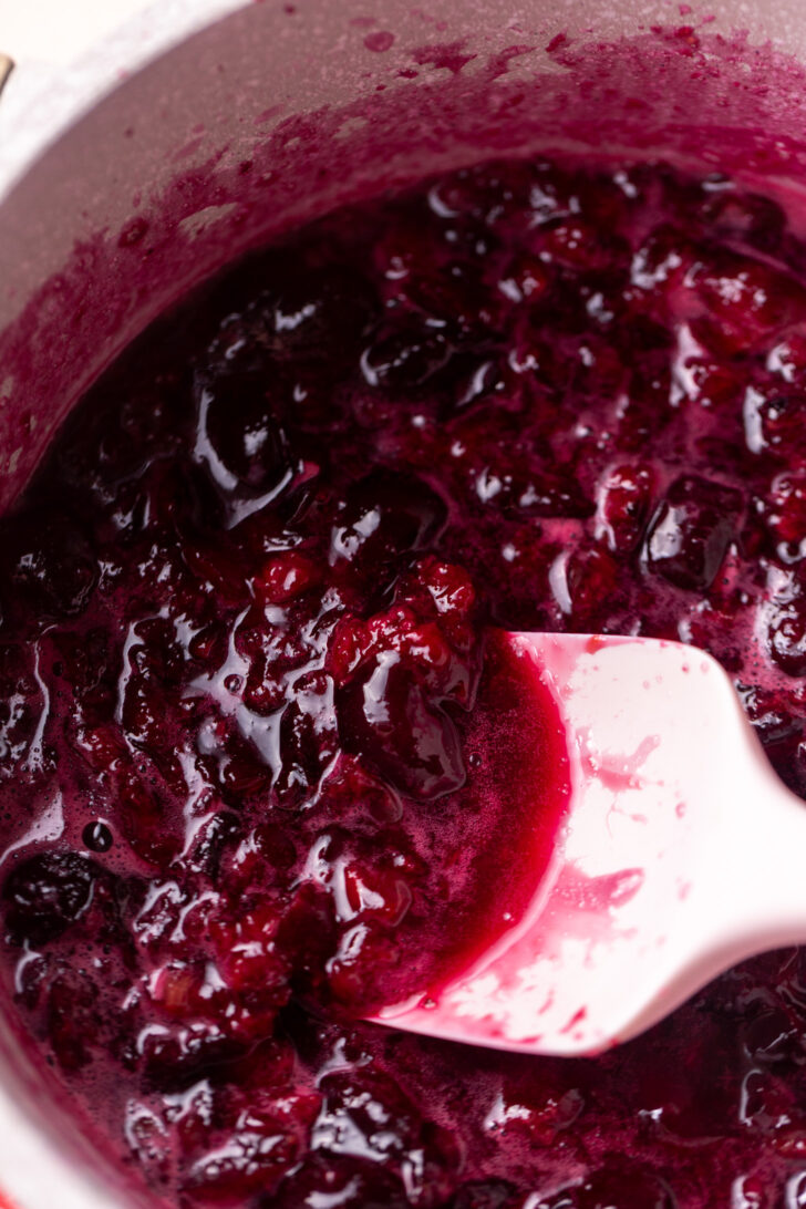 Liquid and cherries in a pot.