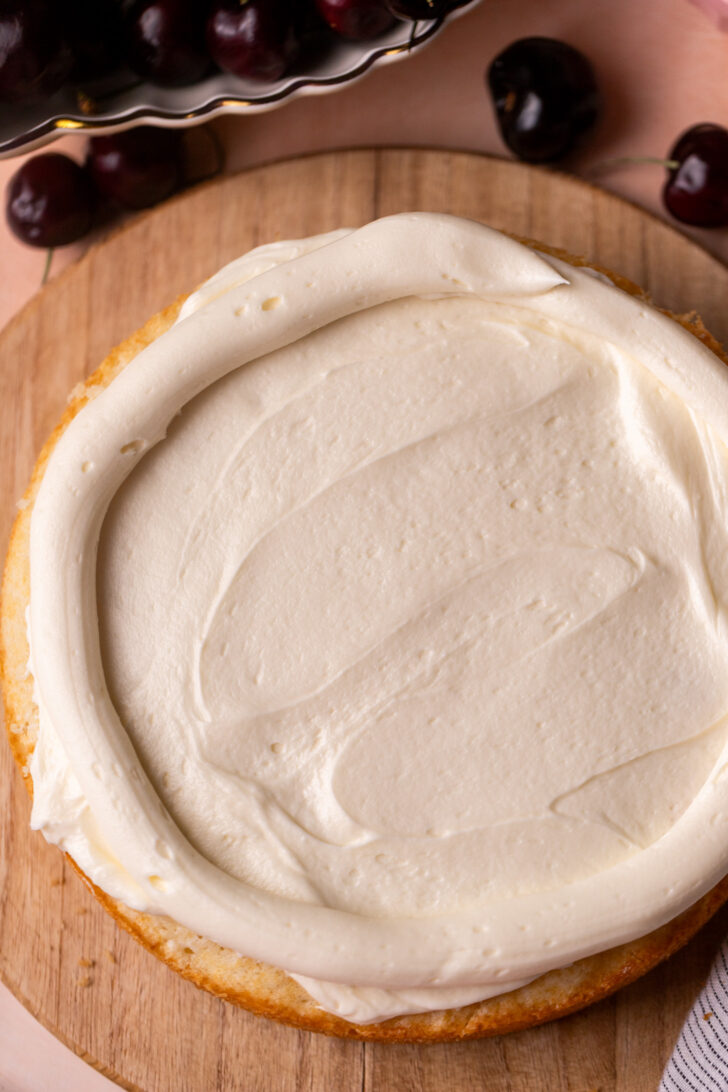 Frosting on top of cake layer.