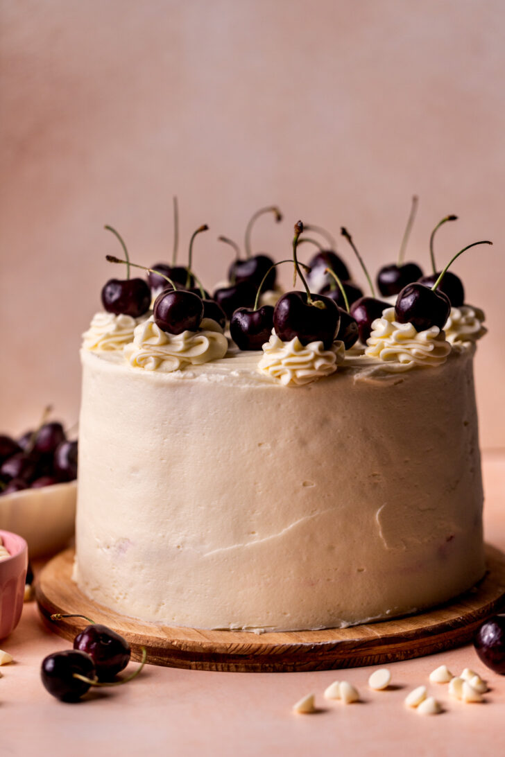 Decorated cake on a wood board.