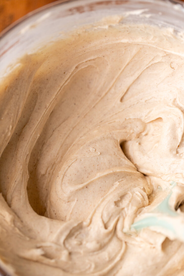 Cinnamon cream cheese frosting in a bowl.