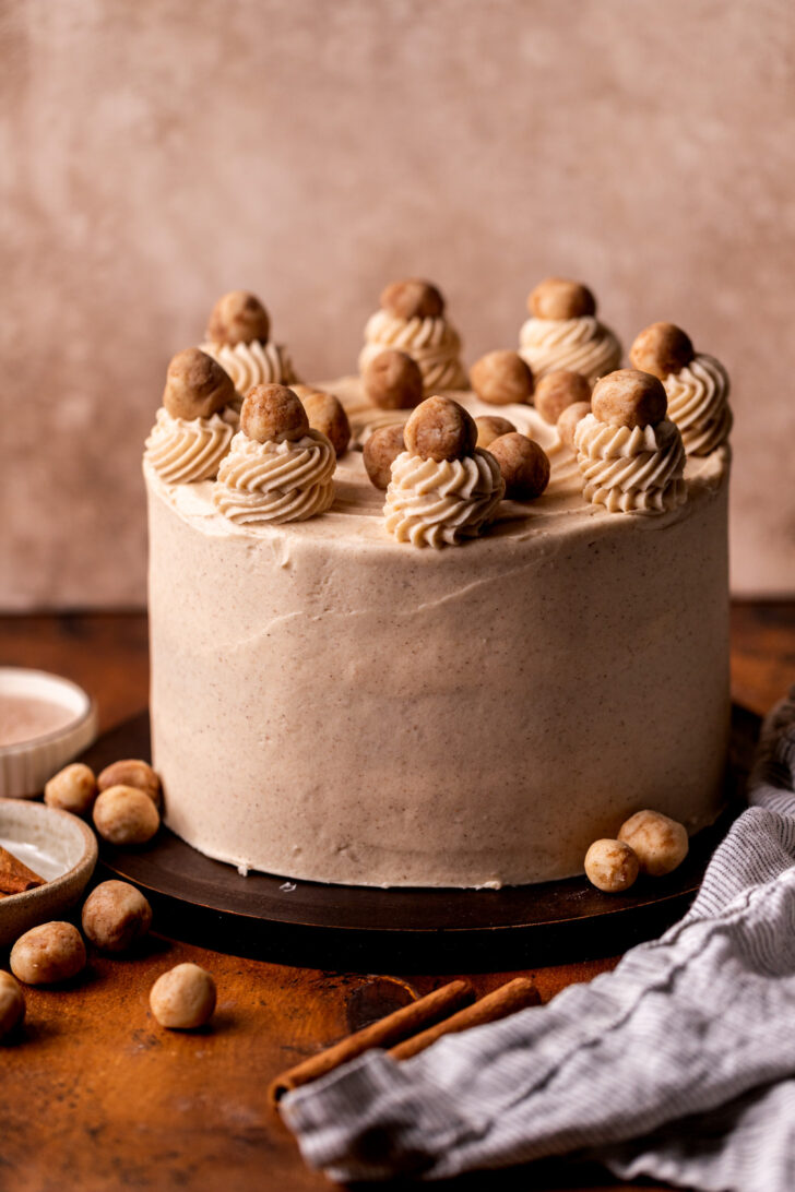 Decorated cake on a wood board.