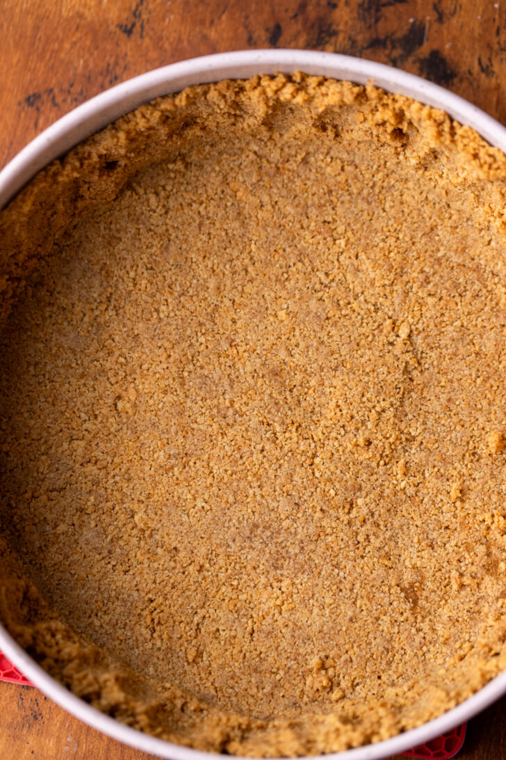 Graham cracker crust in a pan.