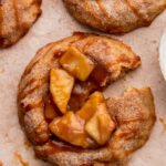 One apple pie cookie split in half.