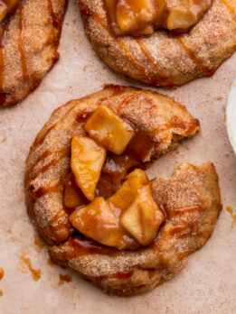 One apple pie cookie split in half.