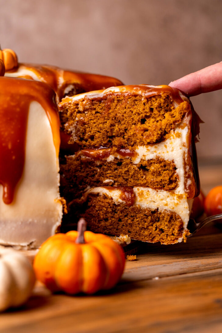 Taking a slice out of the cake.