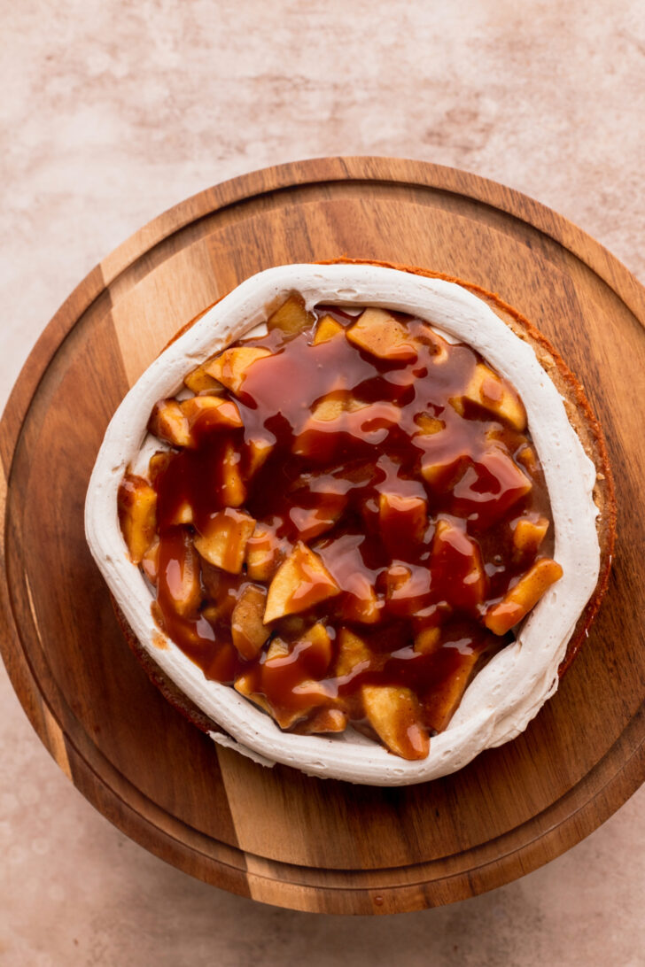 Apple pie filling and caramel on top of cake.
