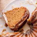 Piece of apple cider donut cake on its side.