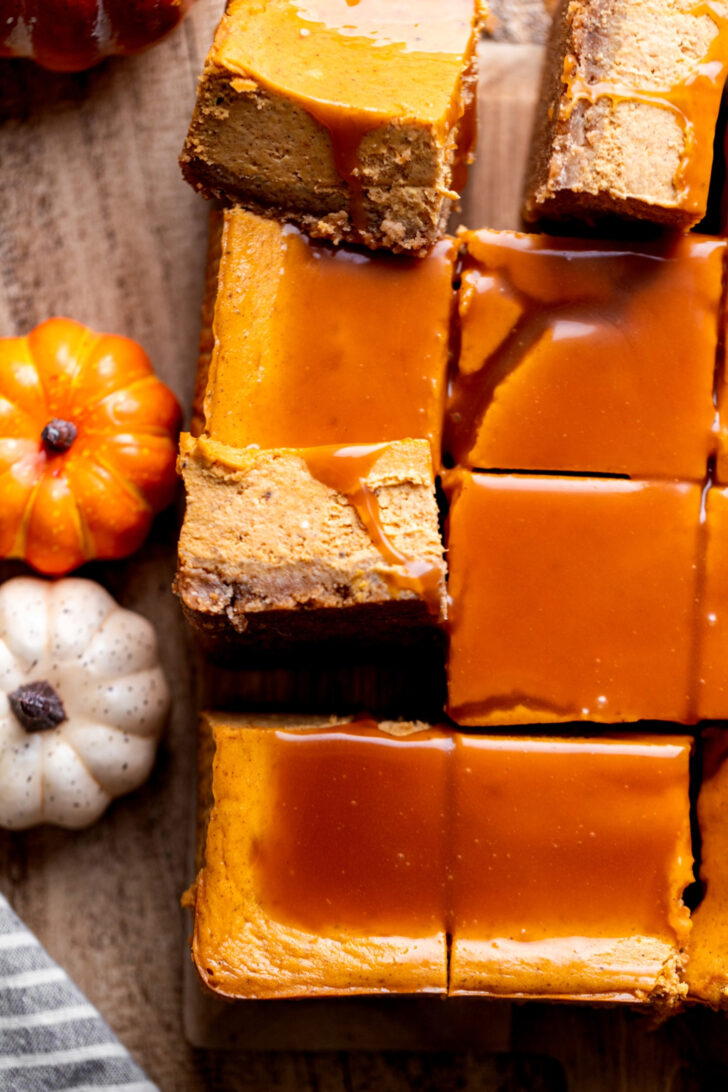 Top view of cheesecake bars with several on their side.