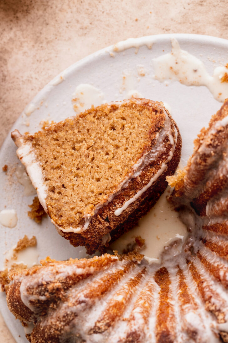 Piece of apple cider donut cake on its side.
