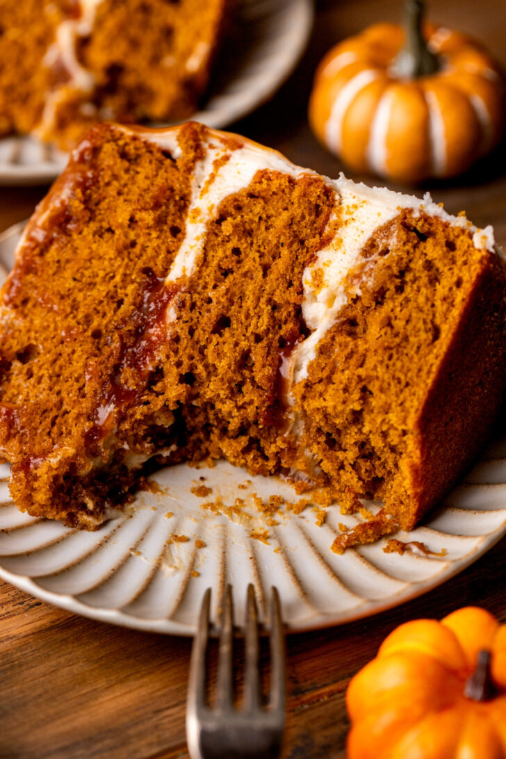 Bite missing from pumpkin caramel cake.
