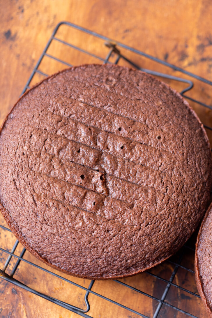 Chocolate cake on a wire rack.