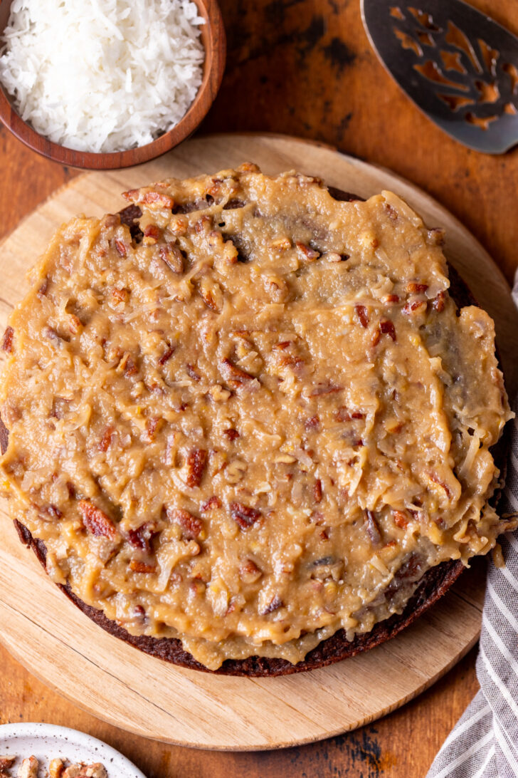 Coconut pecan frosting on top of cake.