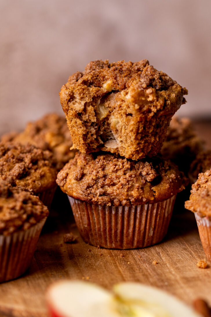 Two apple muffins topped on each other.