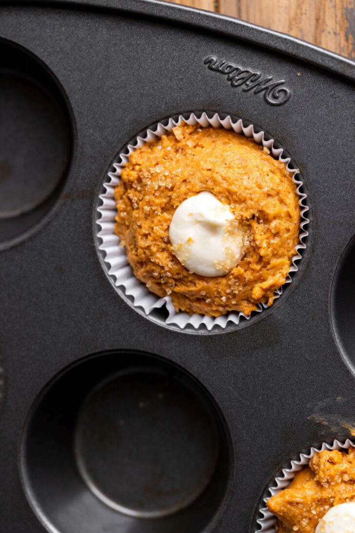Cream cheese filling inside the muffin batter.