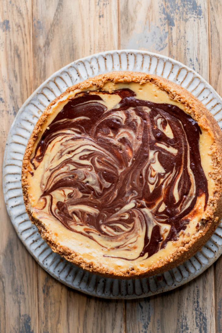 Baked cheesecake on a platter.