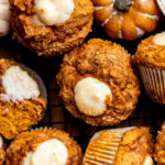 Close up top view of pumpkin cream cheese muffins.