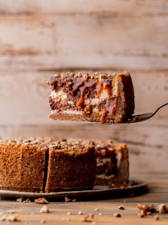 Taking a slice out of turtle cheesecake.