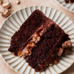 Slice of twix cake on a plate.