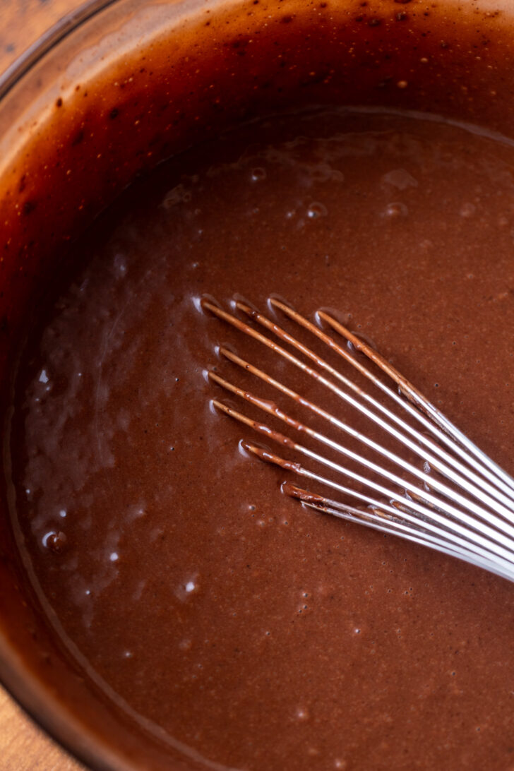 Chocolate cake batter in a bowl.