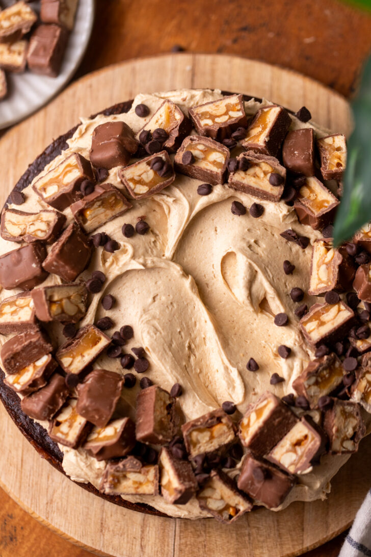 Decorated cake on a wood board.