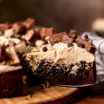 Taking a slice out of the snickers cake.