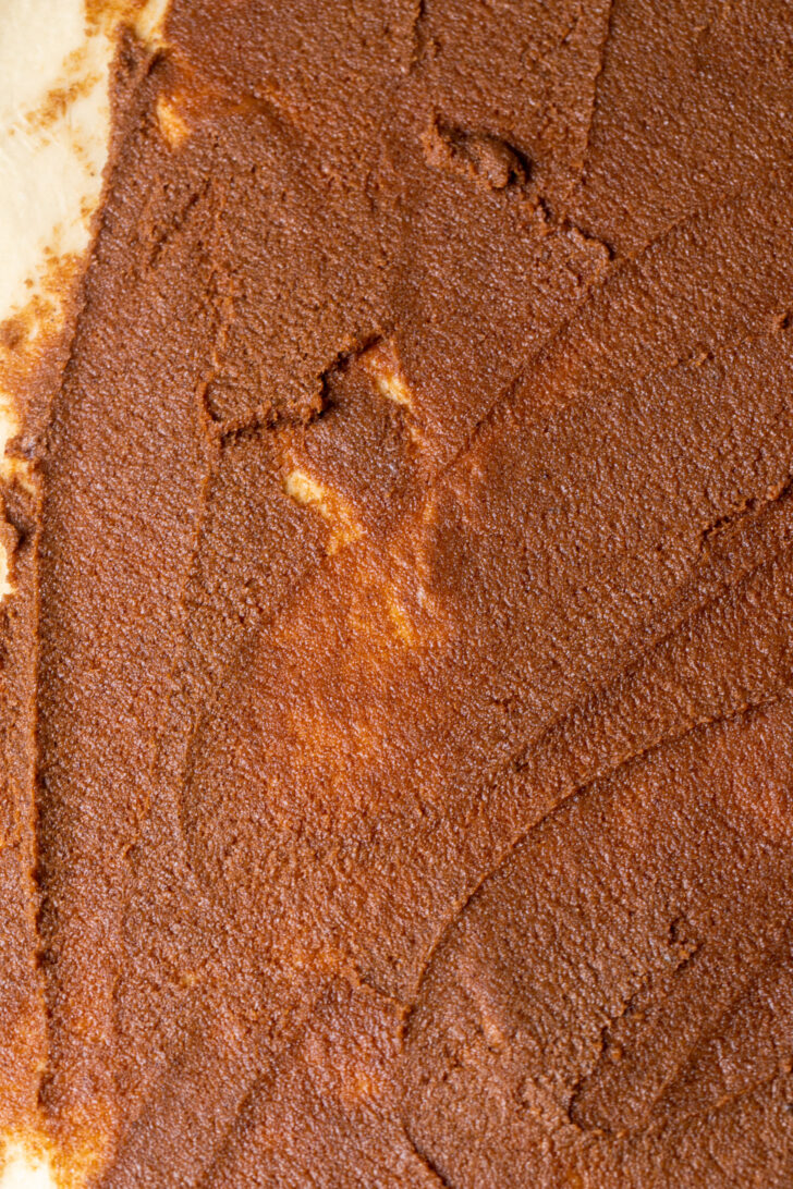 Cinnamon filling on top of dough