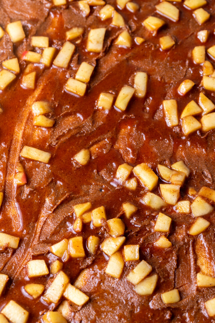 Apple pie filling on top of dough.