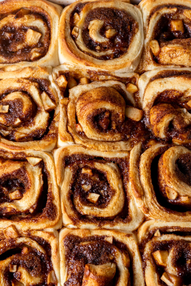 Baked cinnamon rolls in a pan.