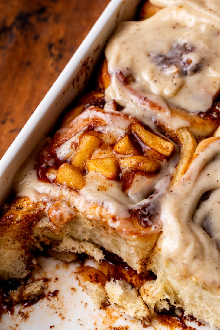 Side view of apple cinnamon rolls in the pan.