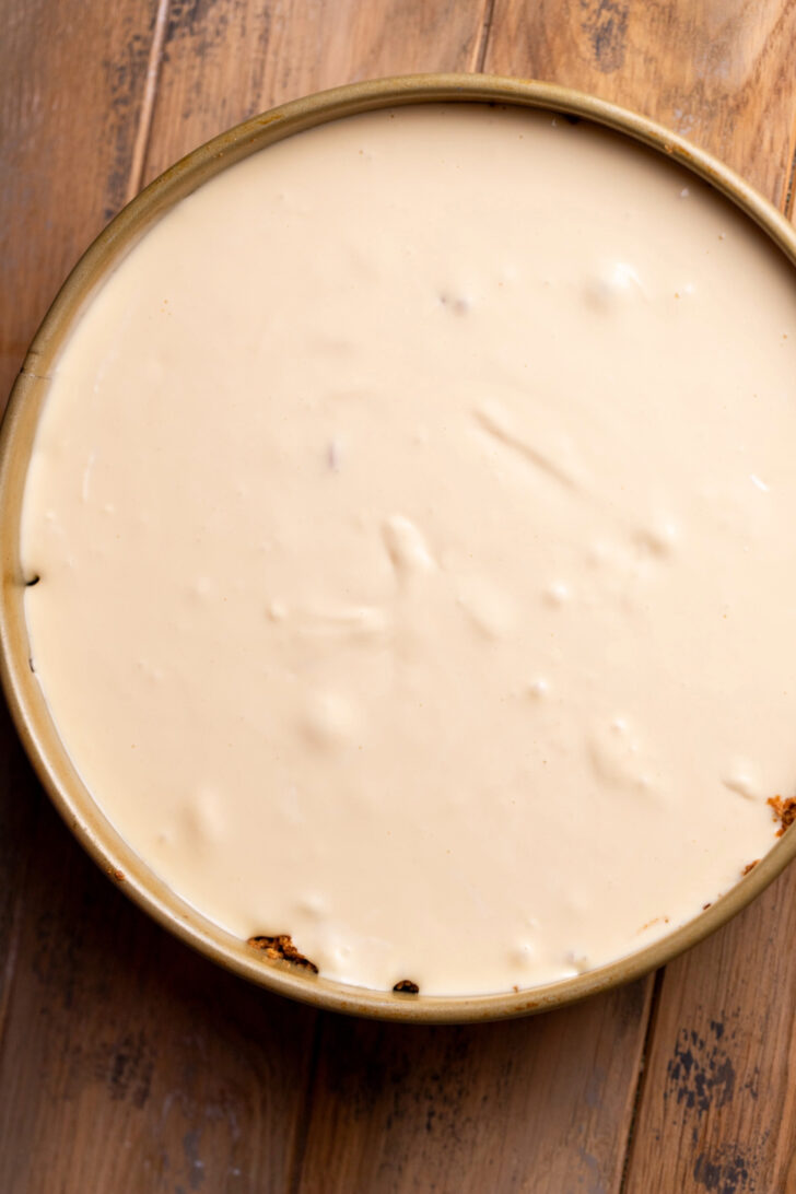 Cheesecake batter on top of apple filling.