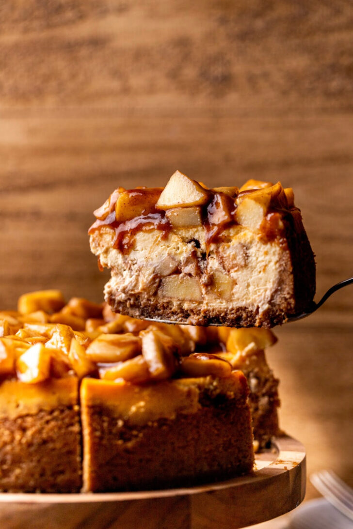 Taking a slice out of the apple cheesecake.