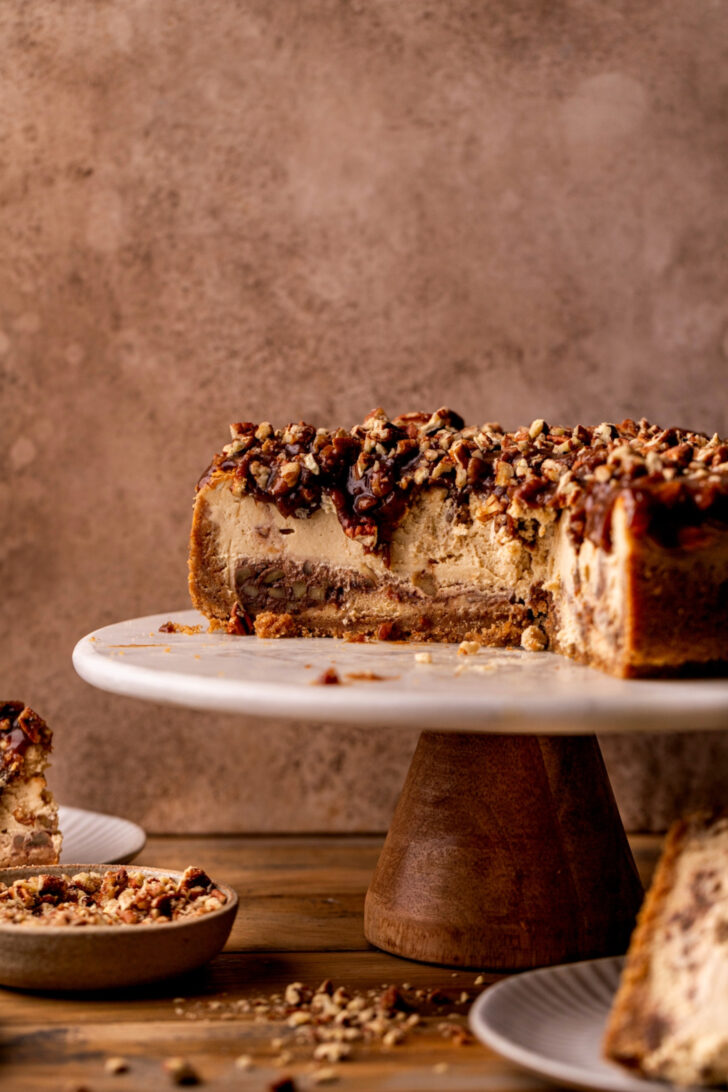 Cheesecake side view on a cake stand.