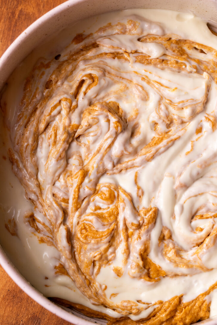 Bottom layer of pumpkin cake and cheesecake swirled together.