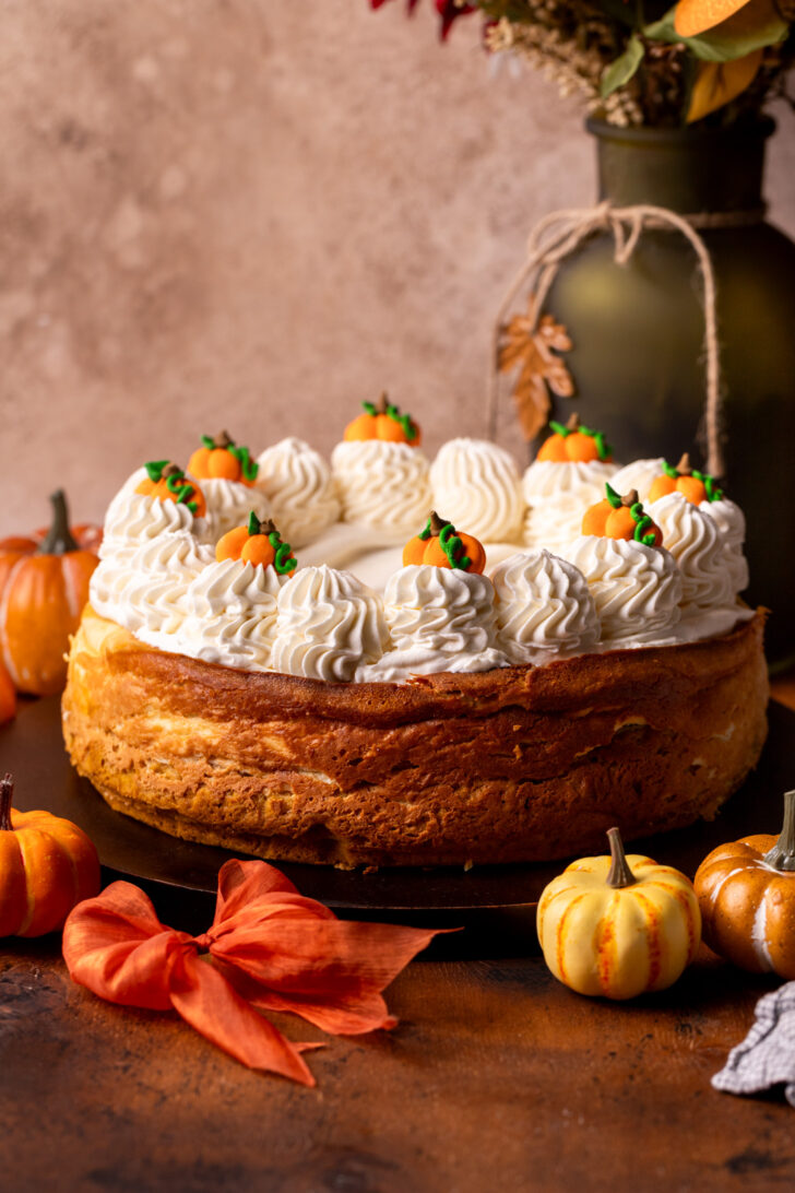 Decorated cake on a wood board.